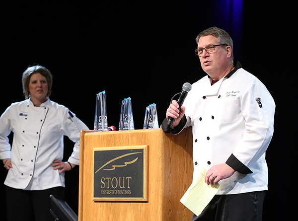 Brian Bergquist, right, and Kristal Gerdes of the School of Hospitality Leadership present awards at the 2018 Recipe for Excellence culinary competition at UW-Stout. 