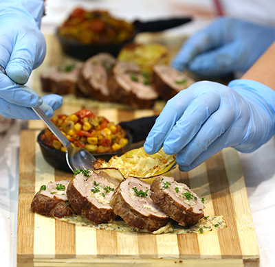 Students prepare a pork entrée with side dishes in the 2018 Recipe for Excellence competition.