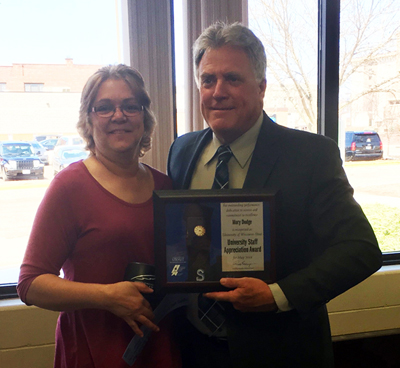 Mary Dodge receives the University Staff Employee Appreciation Award for May from Chancellor Bob Meyer.