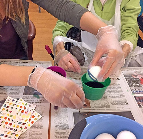 ​​Decorating eggs helps bring back memories for both the residents and students.