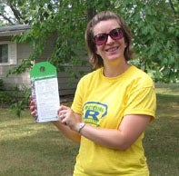 Student shows test results from soil sample