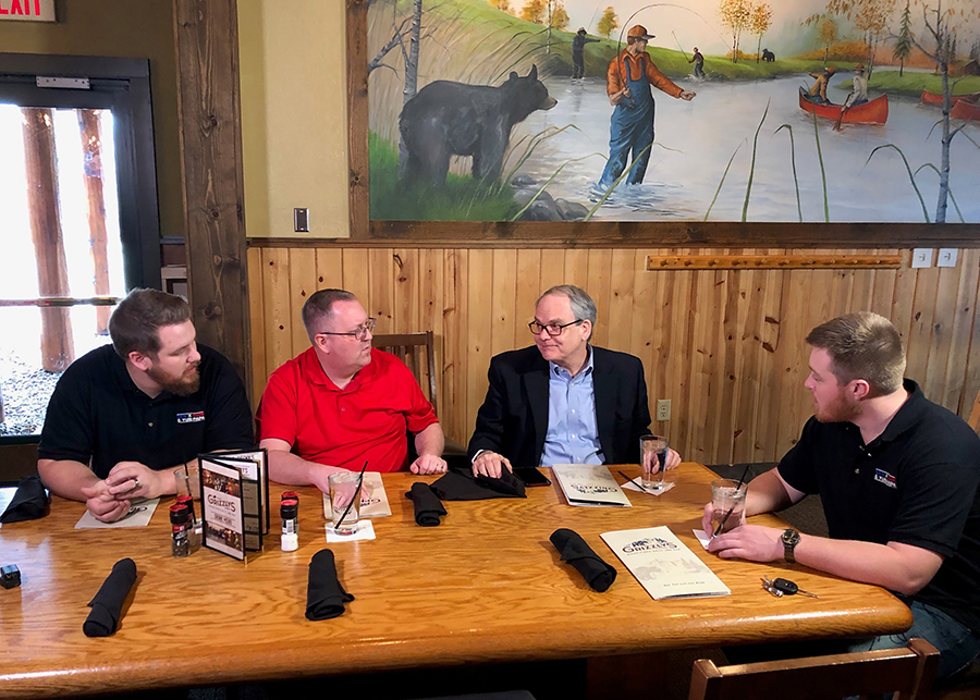 From left, Domanick Bainey, Scot Vaver, Dan Schillinger and Dale Mord discuss the “Exploring America” series. Schillinger is news director at WQOW TV 18 in Eau Claire.
