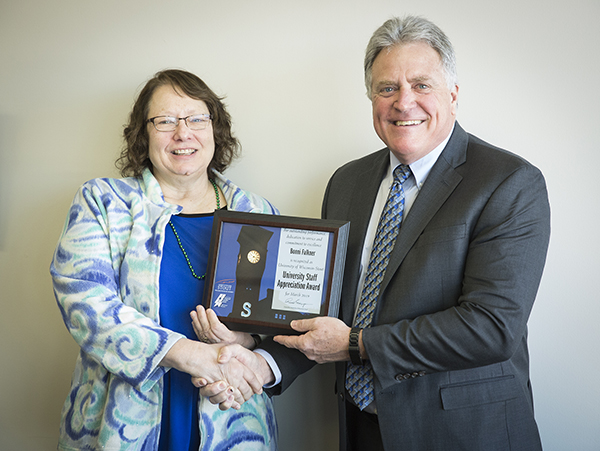 Bonni Falkner receives the University Staff Employee Appreciation Award for March from Chancellor Bob Meyer.