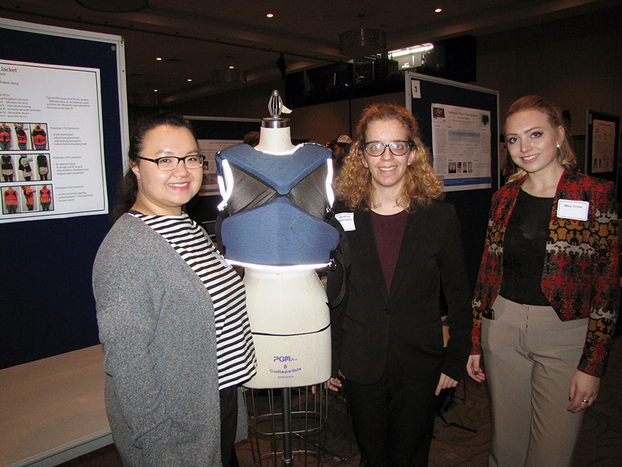 UW-Stout students Pakou Vang, at left, Veronica Baillargeon and Mary Cross designed a personal floatation device designed to better fit women.