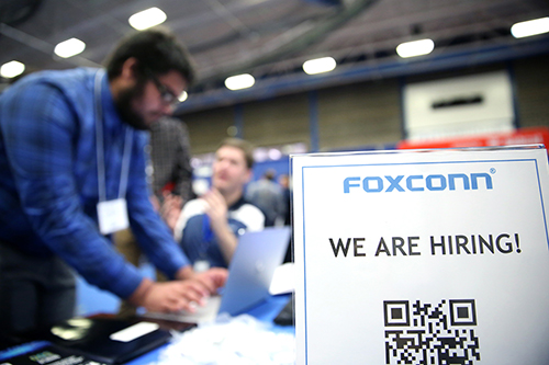 A sign at the Foxconn booth told students that the company is ready to hire for its new Wisconsin facilities.