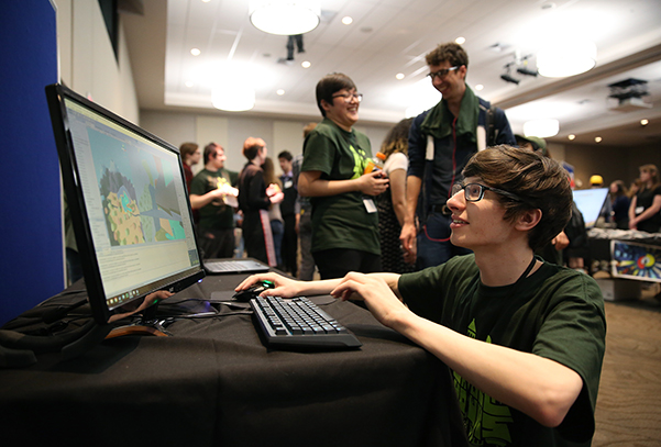 A visitor tries a student-designed game at a recent Stout Game Expo.