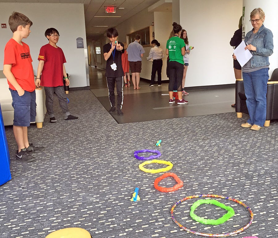  Students at the intercultural leadership portion of the Summer STEAM Experience last year shoot foam rockets after different groups received varying instructions on how to play a game. 