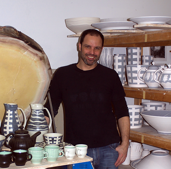 Alumnus Ryan Greenheck works in his studio in Philadelphia. He recently received a $10,000 national grant.