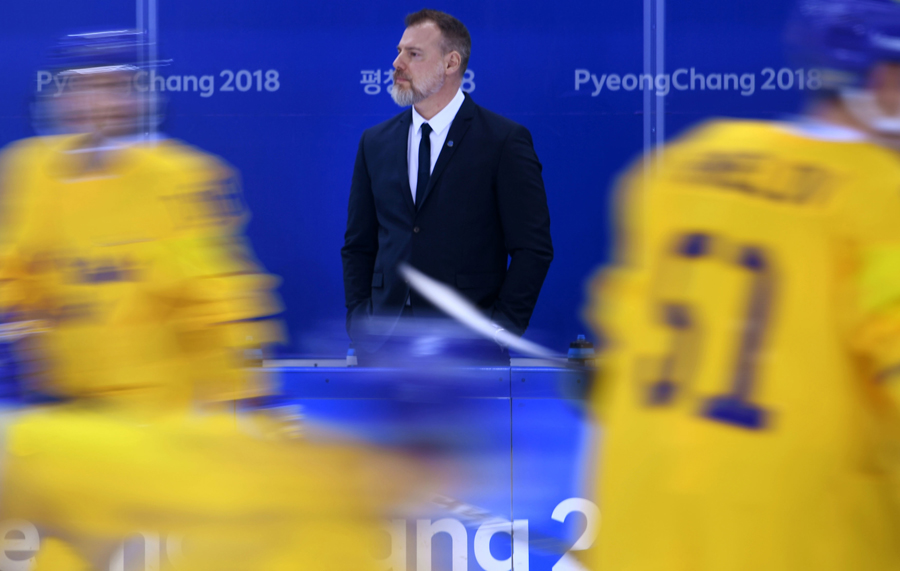 Rikard Gronborg watches Olympic action from Sweden's bench.