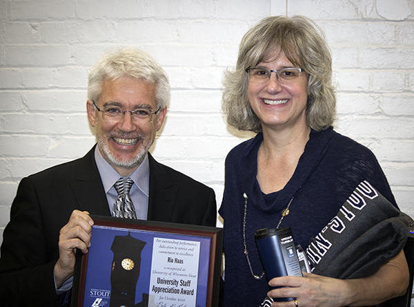 Ria Haas received the University Staff Employee Appreciation Award for October at UW-Stout from interim Chancellor Patrick Guilfoile.