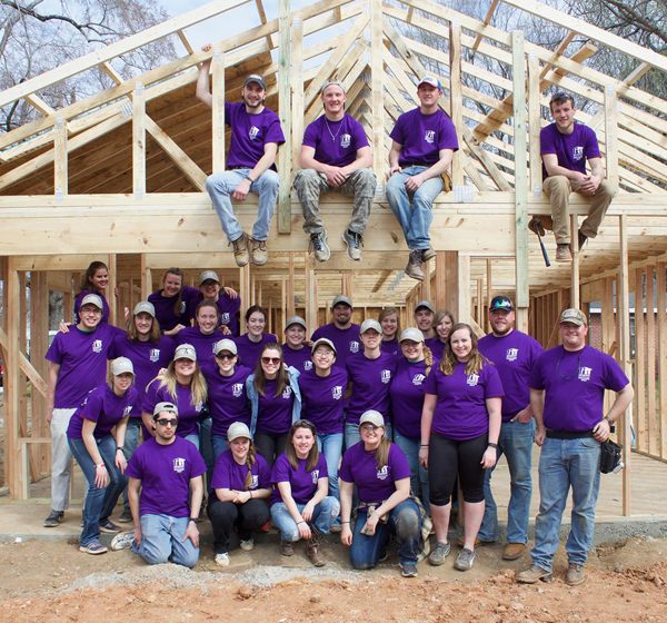 Members of UW-Stout’s Habitat for Humanity student chapter help build a house in Phoenix City, Ala., during spring break in 2017. 