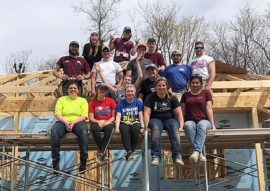 Nilu Umarova, front row right, helps build a home in North Carolina in 2019 with UW-Stout’s student chapter of Habitat for Humanity.