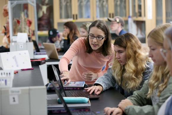 Tiffany Hoage, a new biology instructor at UW-Stout, works with students during the first day of fall semester classes, Sept. 6.