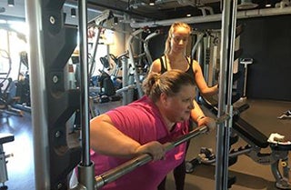 Photo of Hope Steppes training a gym member.