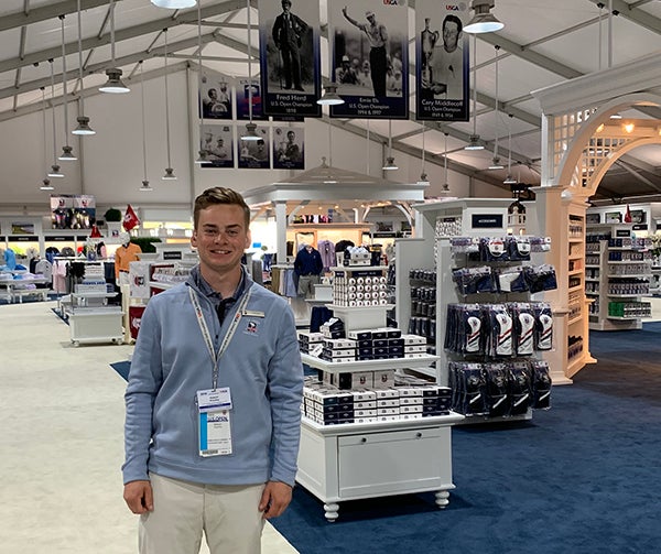 Sawyer Hrycay is an intern in the merchandise tent at the U.S. Open golf tournament, being held at Pebble Beach in California.