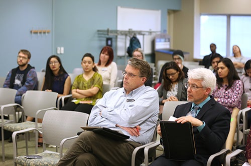 Two of the judges were, at left, Randy Hulke, executive director of the Discovery Center at UW-Stout, and UW-Stout Provost Patrick Guilfoile.