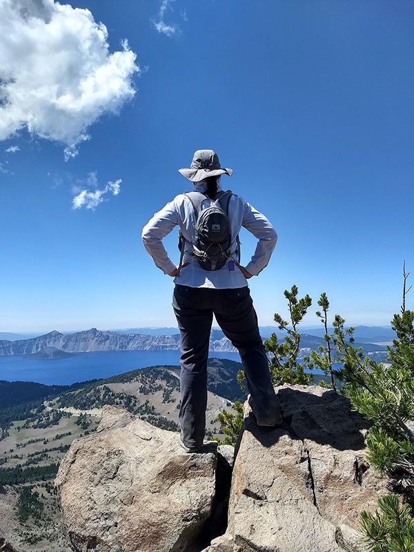 Jessica Kastello looks at Crater Lake from the top of Mount Scott, a three-hour hike to the highest point in the national park.
