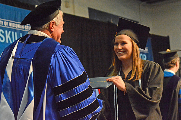 Katie LaBuda receives her diploma from Chancellor Bob Meyer.