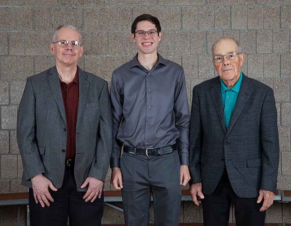 The first UW-Stout Landsverk Endowed Family Scholarship was awarded in fall 2019 to student Chase Heim, center. Don Landsverk, right, and his wife, Donna, started the scholarship with their family, including son David, left, a UW-Stout alumnus.