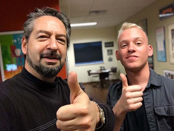 UW-Stout video production student Devin Leary, right, edited “The Most Epic Music Video in LinkedIn History,” which co-starred branding expert David Brier, left, of Menomonie.