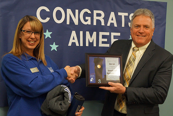 Aimee Lipke receives the University Staff Employee Appreciation Award for February from Chancellor Bob Meyer.