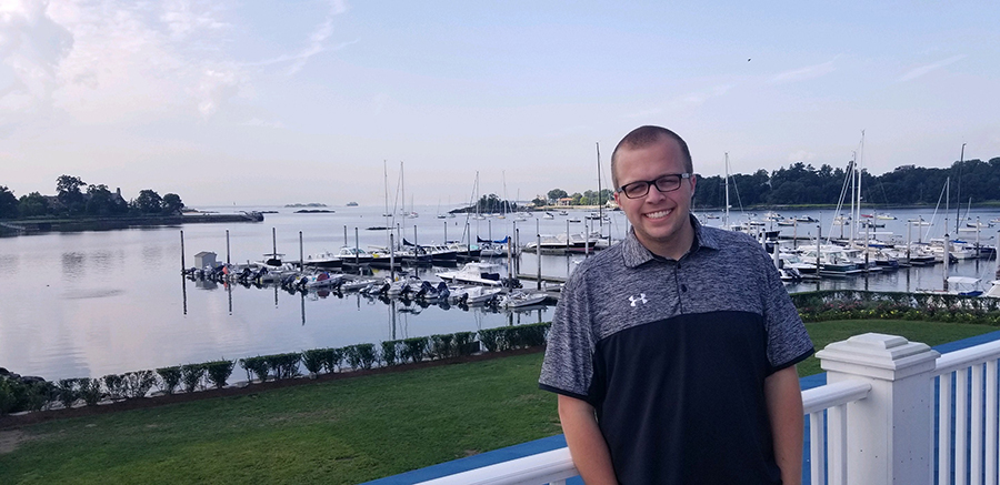 Sean Mallery, who is helping coordinate the CMAA silent auction Dec. 3 at UW-Stout, takes a break at the Riverside Yacht Club in Greenwich, Conn., where he has had co-op positions the past two summers.
