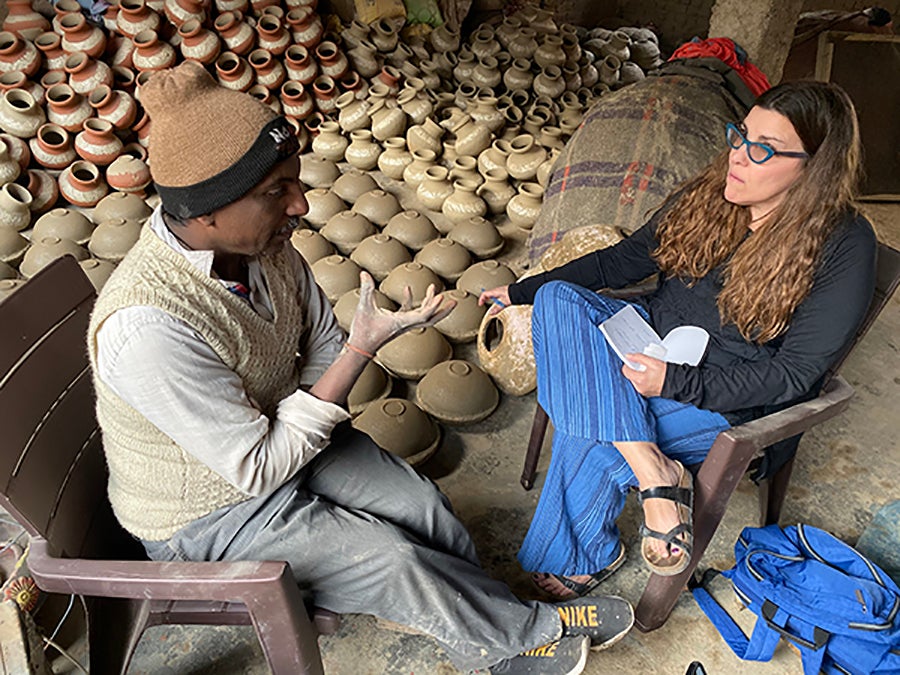 Professor Kate Maury interviews potter Jagmohan when she visited the business run by him and his brother in India.