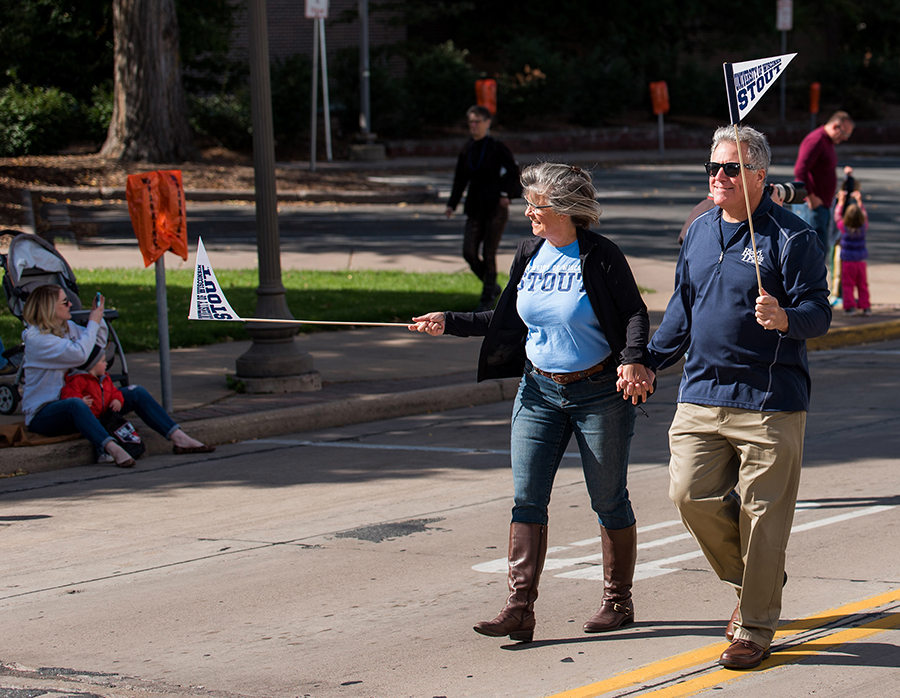 Meyer walks in the October 2015 UW-Stout homecoming parade with his wife, Debbie. Both of them are UW-Stout graduates.