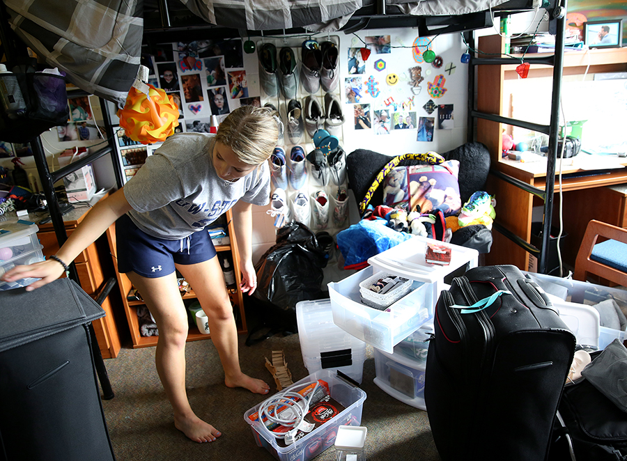 First-year student Maya Smith of Alma unpacks and gets settled into her room in Keith Hall on UW-Stout Move-in Day in 2018.