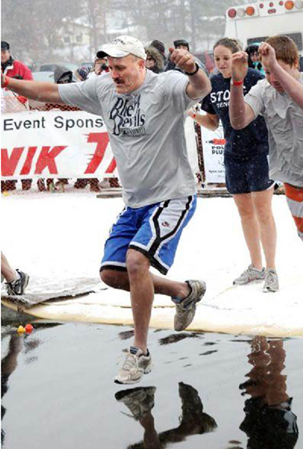 UW-Stout Athletic Director Duey Naatz takes the leap at a prior Polar Plunge to raise money for Special Olympics.