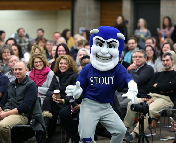 Blaze, the UW-Stout mascot, dances during a surprise visit to the program.