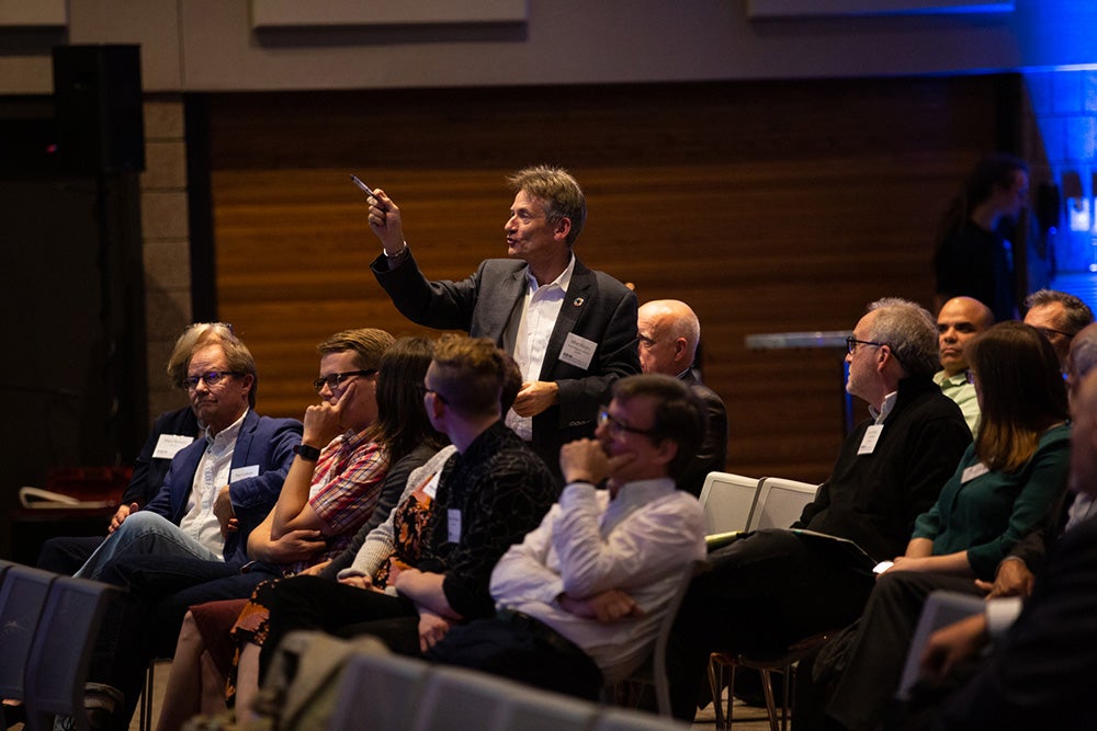 An attendee asks a question during the Polytechnic Summit