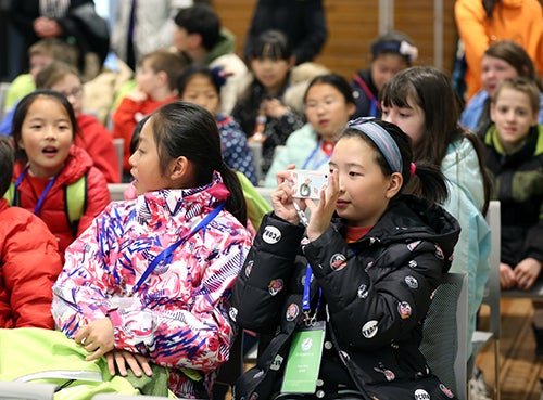 Chinese students take pictures during their visit to UW-Stout