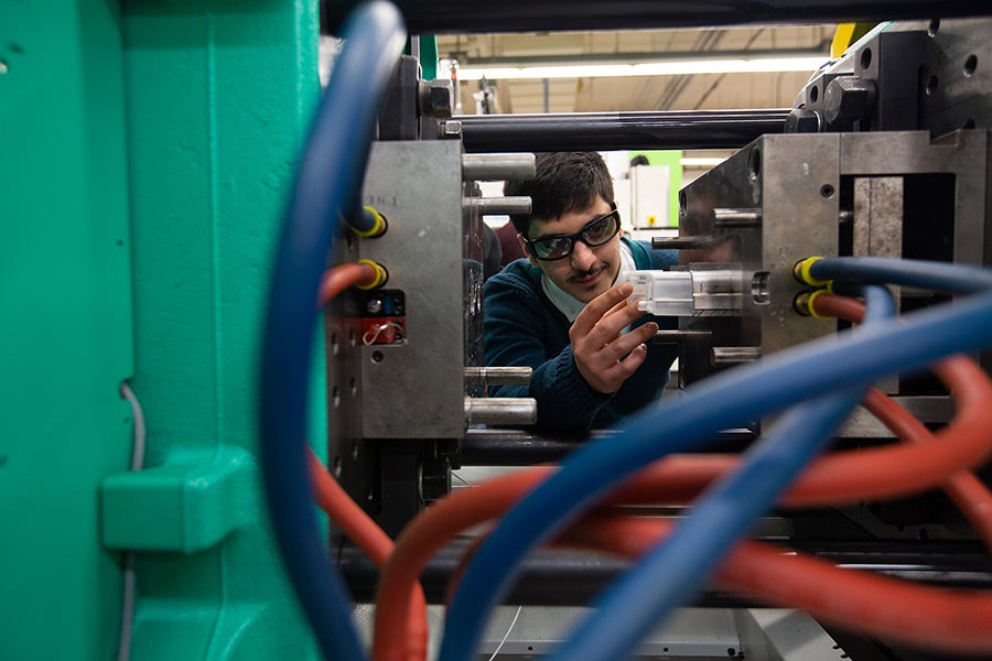 UW-Stout’s plastics engineering program offers exclusive scholarships for students. Pictured is a student working in the UW-Stout Plastics Lab.