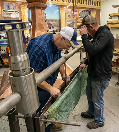 Workers for Building Restoration Corp. restore the quill in their shop in Minnesota.