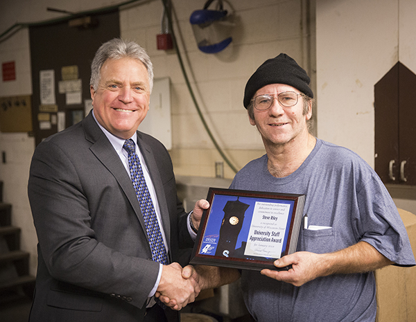 Steve Riley, right, receives the University Staff Employee Appreciation Award for January from Chancellor Bob Meyer.