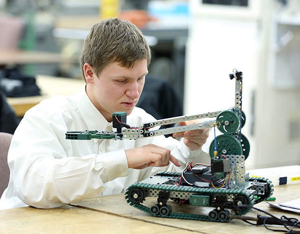 David Craig of Oregon High School works on his search and rescue robot during the 2018 SkillsUSA competition at UW-Stout.
