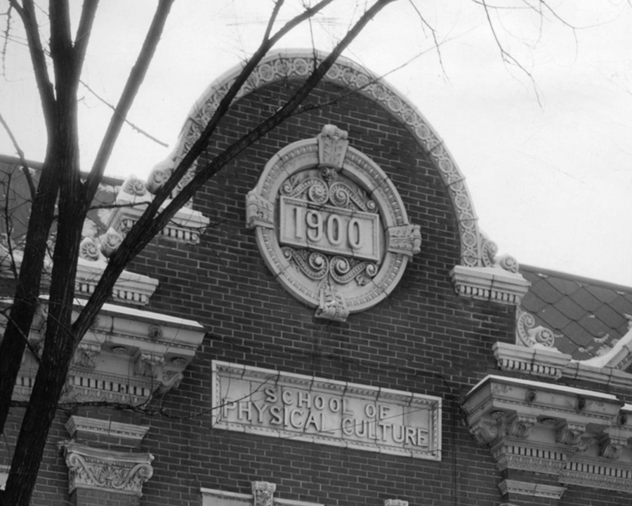 The medallion on the School of Physical Culture building marked the date Sen. James H. Stout announced the building would be constructed.