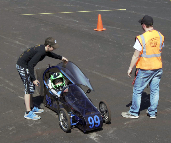 A UW-Stout TEECA member prepares to start a car at the 2017 event.