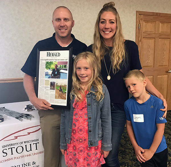 Justin Utpadel, UW-Stout alumnus and employee, was recognized Aug. 8 at Stories of Honor with his family, including daughter, Raegan; wife, Jackie; and son, Logan.