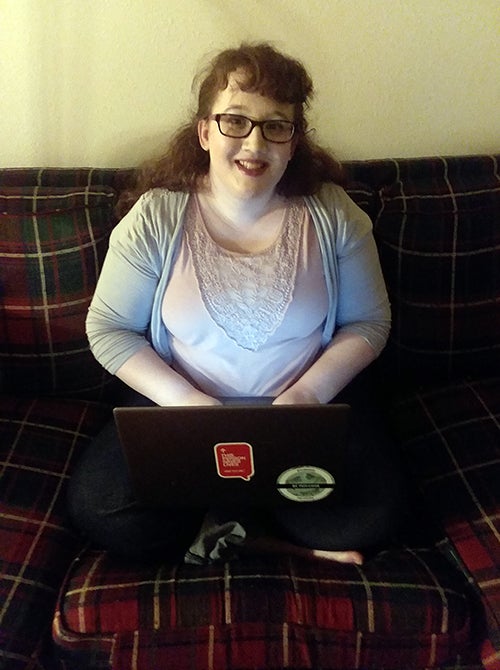 Katie Jo Walker, of Menomonie, finds a comfortable spot on the couch to study at home during her final two months as a senior at UW-Stout.