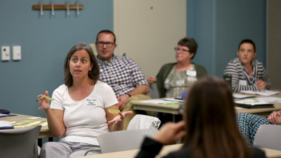Staff member Alex Hall, left, talks during the Engagement Sessions on campus Monday, Aug. 28.