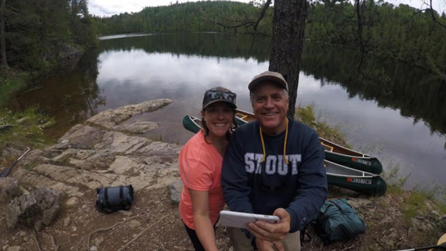UW-Stout Chancellor Bob Meyer and his daughter, Erica, stop at a campsite in Quetico Provincial Park in Canada during a summer wilderness canoeing trip.