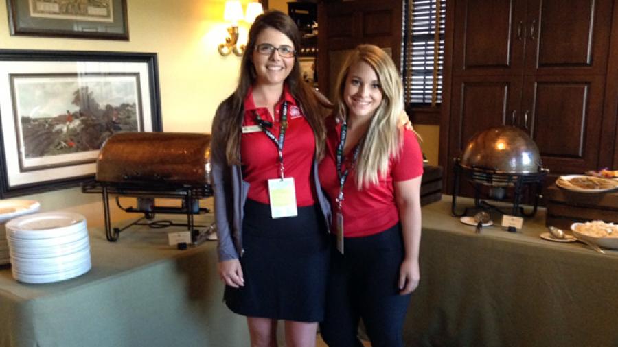 UW-Stout students and Erin Hills interns Savannah Stock, left, and Rylee Vincent work in the clubhouse at Erin Hills during the U.S. Open.