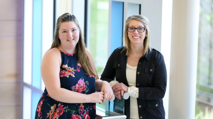 Students Kaitlin Travis, left, and Taylor Laube had Cooperative Education Program experiences over the summer at Thomson Reuters related to their studies in digital marketing technology.