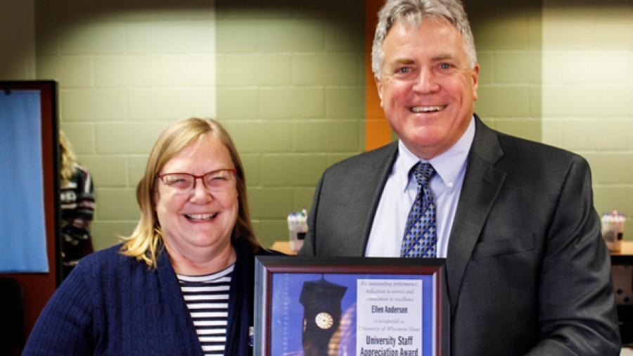 Ellen Anderson receives the University Staff Employee Appreciation Award for December from Chancellor Bob Meyer.