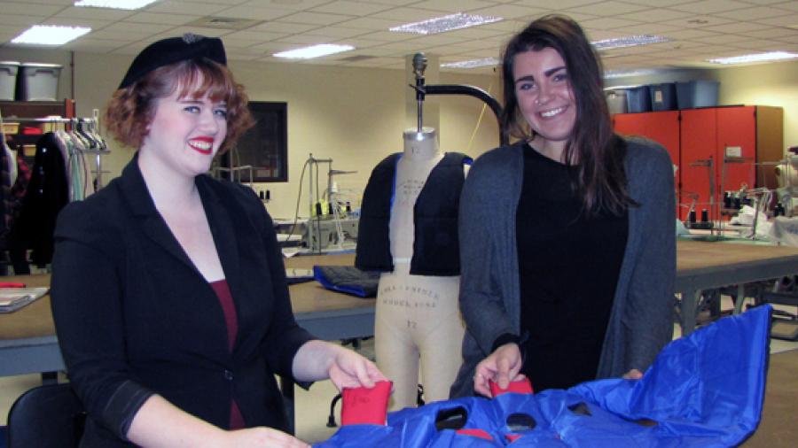 UW-Stout apparel design and development students Kalli Smith, left, and Megan Vande Walle display weighted vests they helped make for a Minnesota school district. The special vests, also seen in the background on the mannequin, help young students who have anxiety.