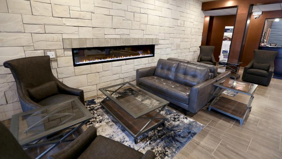 The lobby at the Cobblestone Inn & Suites includes a fireplace.