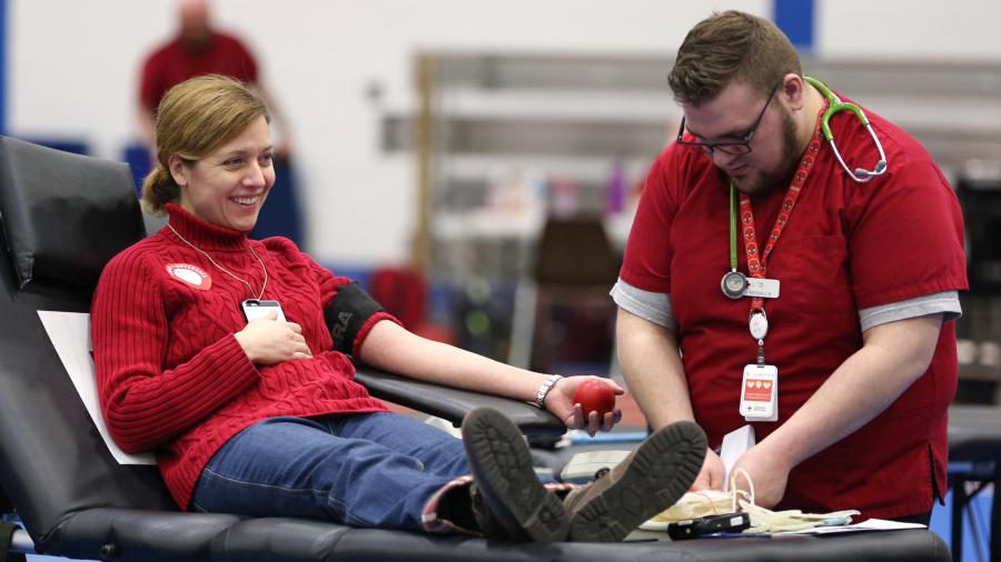 A UW-Stout employee gives blood during the 2017 Wellness Fair on campus.