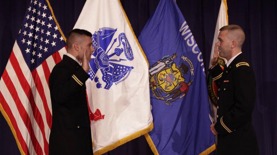 A cadet, left, takes the Oath of Office during a recent Northwoods Battalion ROTC commissioning ceremony.